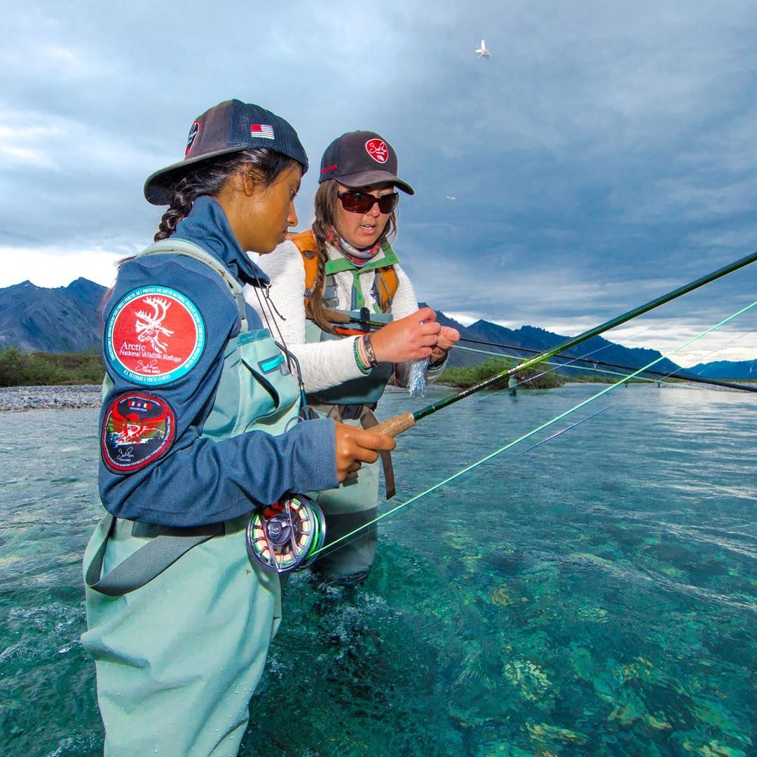 Soul River volunteer teaching flying fishing to youth bipoc attendee